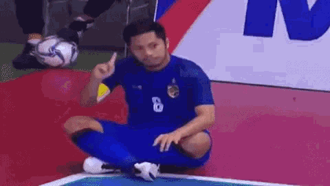 a soccer player with the number 8 on his shirt