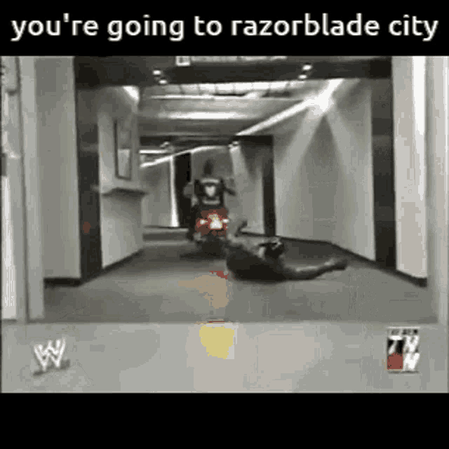 a man is riding a motorcycle down a hallway with the caption you 're going to razorblade city .