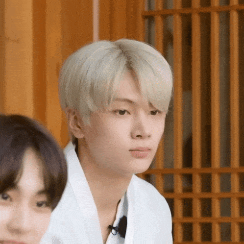 a close up of a person with blonde hair