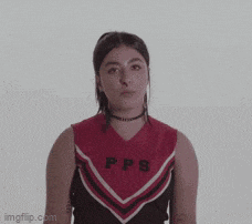 a close up of a woman 's face with a choker around her neck .