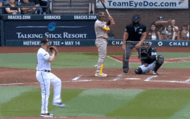 a baseball game is being played in front of a talking stick resort sign