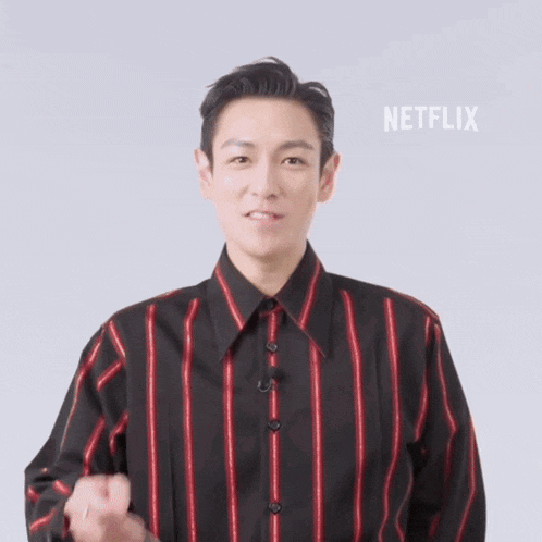 a man wearing a black and red striped shirt with netflix written on the bottom right