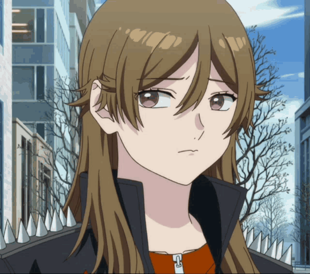 a girl with long brown hair is wearing a jacket with spikes on it