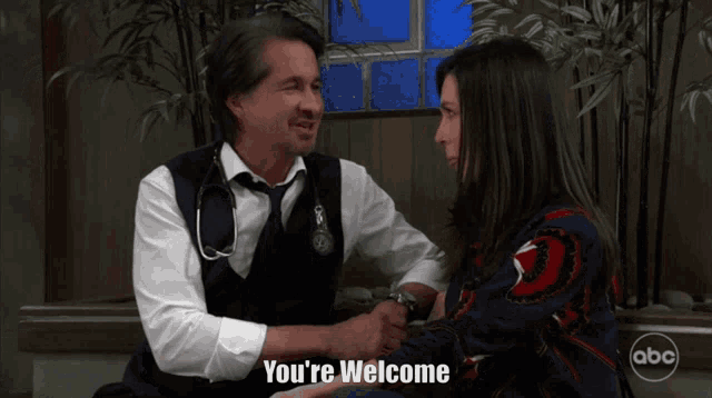 a man with a stethoscope on his vest talks to a woman with the words you 're welcome on the bottom