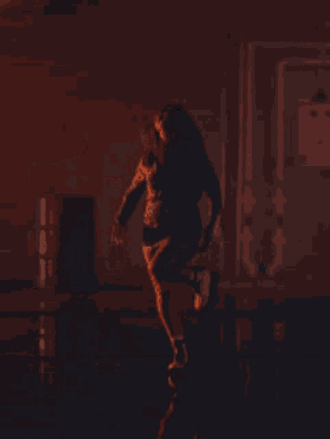 a woman in a white dress is dancing on a stage