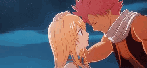 a man and a woman are touching each other 's foreheads in a fairy tail anime scene .