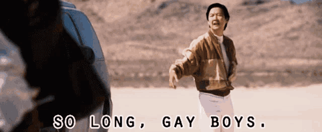 a man standing in the desert with the words so long gay boys behind him