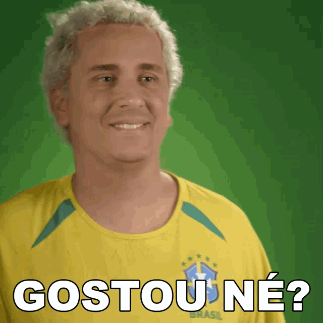 a man is wearing a yellow shirt that says brasil on it
