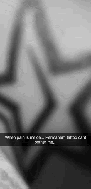 a black and white photo with the words " when pain is inside permanent tattoo can t bother me "