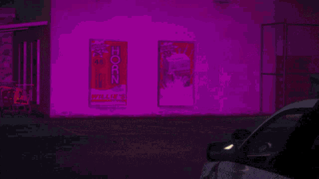 two posters on the side of a building advertising horn willie 's