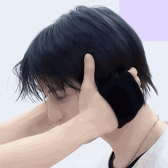 a close up of a person 's ear with the word ayoto written on the bottom