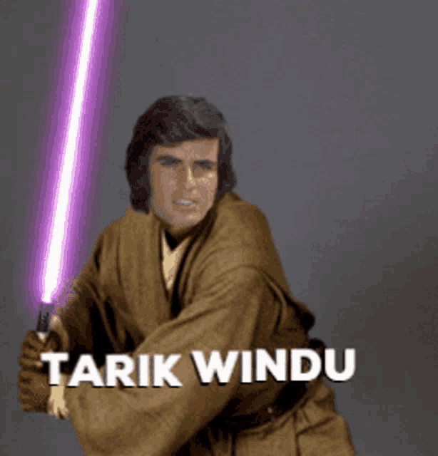 a man in a brown robe is holding a purple light saber with the name tarik windu on the bottom