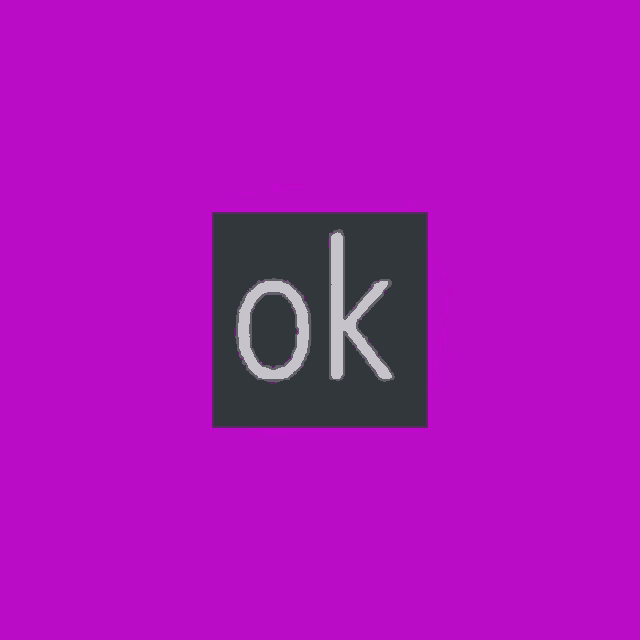 a black cube that says ok on it on a purple background