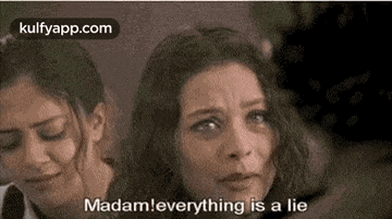 two women are crying together and one of them is saying `` madam , everything is a lie '' .