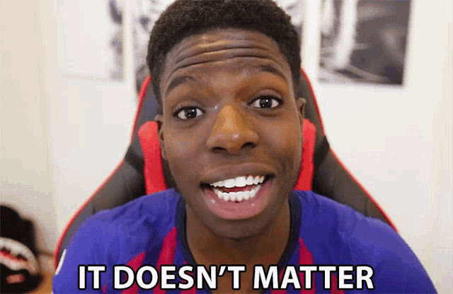 a young man sitting in a chair with the words it does n't matter on his shirt