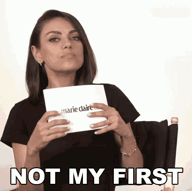 a woman is holding a piece of paper that says marie claire .