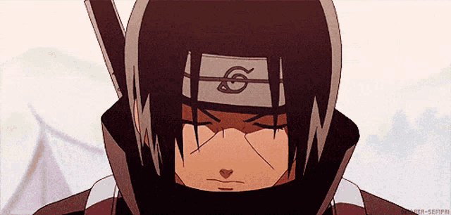 a close up of a person wearing a headband with a symbol on it