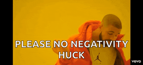 a man in an orange jacket with the words please no negativity huck written below him
