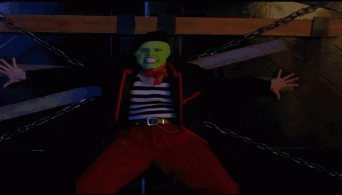 a man wearing a green mask and a red scarf