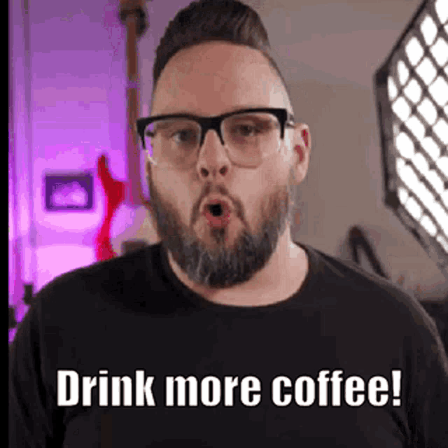 a man with a beard and glasses is making a funny face and saying `` drink more coffee '' .
