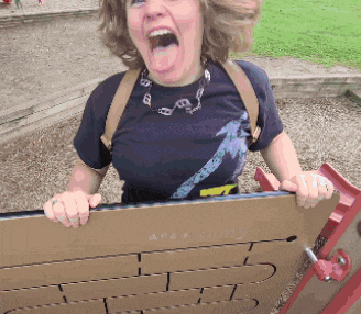 a woman with her mouth open is holding a piece of cardboard that says " are a buddy " on it