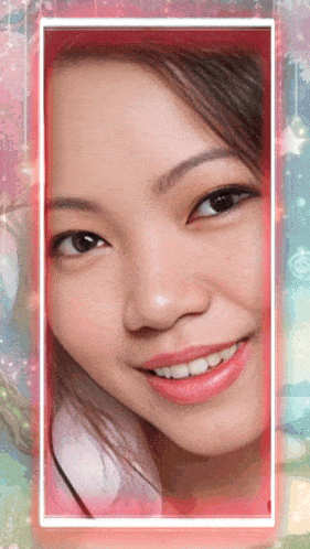 a close up of a woman 's face with a pink border