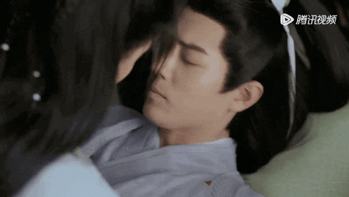a man and a woman kissing with chinese writing on the bottom