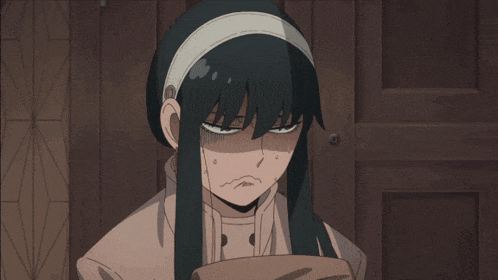 a girl with long black hair and a white headband is looking down