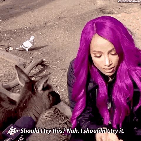 a woman with purple hair says should i try this nah i shouldn't try it