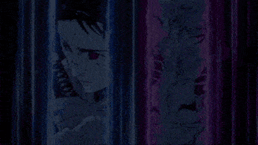 a man and a woman are standing next to each other in a room behind bars .