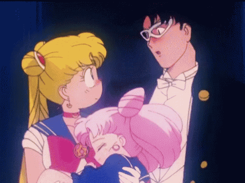 a man in a tuxedo holds a girl in his arms