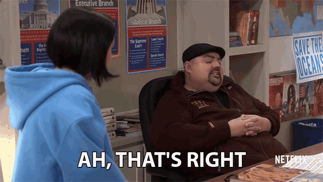 a man sitting at a desk with the words ah that 's right written on it
