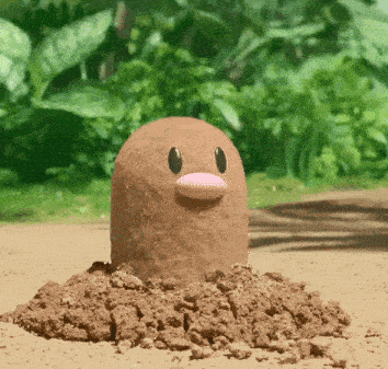 a mole with a pink beak is sticking its head out of the ground