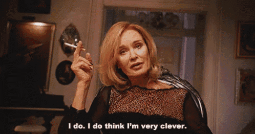 a woman smoking a cigarette and saying " i do i do think i 'm very clever "