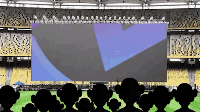 a large screen in a stadium with people watching