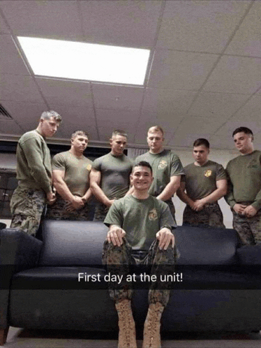a group of soldiers are posing for a picture and the caption reads first day at the unit