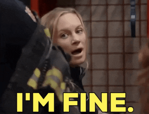 a woman in a fireman 's uniform says i 'm fine
