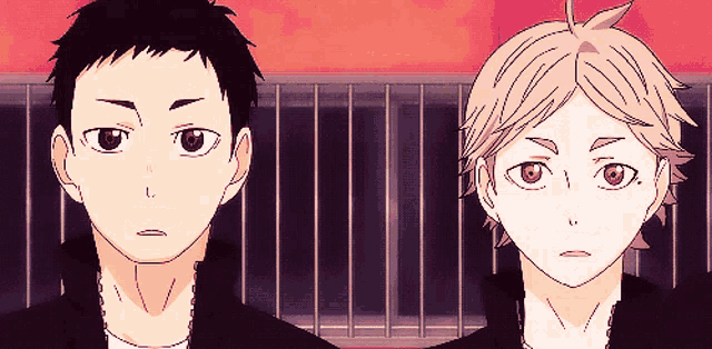 two anime characters are standing next to each other and one has the letter l on his face