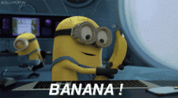 a minion is holding a banana in front of a keyboard that says banana on it