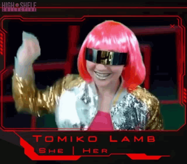 a woman wearing a pink wig and a gold jacket is named tomoko lamb