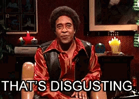 a man in a red shirt is sitting in a chair with the words that 's disgusting behind him