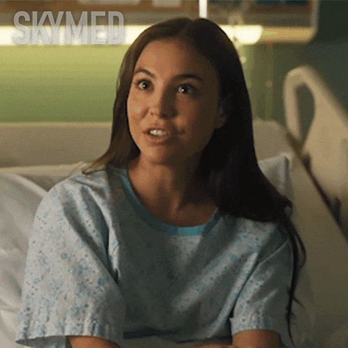a woman is laying in a hospital bed with the word skymed on the bottom