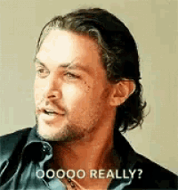 a man with long hair and a beard is making a funny face and saying `` oooo really ? ''