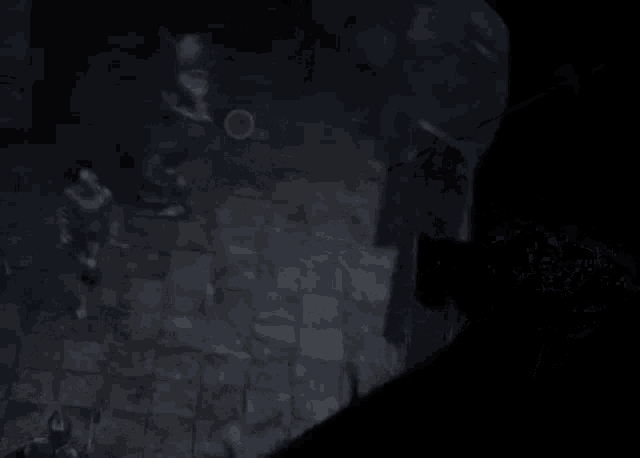 a dark room with a door that has a letter b on it