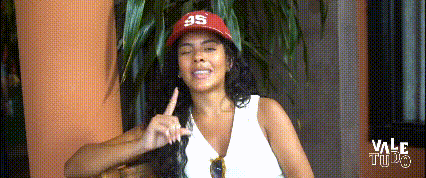 a woman wearing a red hat that says 95