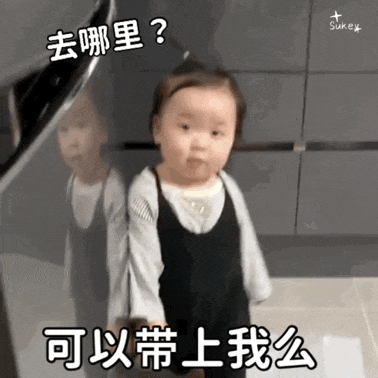a little girl is standing in front of a mirror with chinese writing on her face