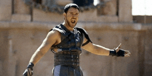 a man with his arms outstretched and a beard