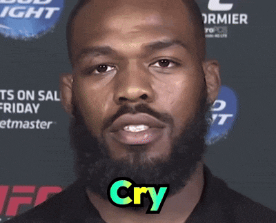 a man with a beard says " cry " in front of a bud light sign