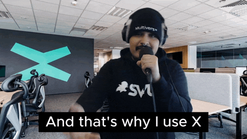 a man singing into a microphone with the words " and that 's why i use x " behind him