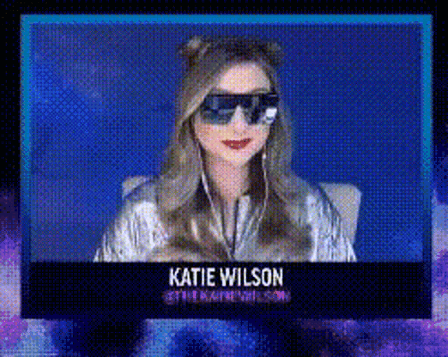 katie wilson is wearing sunglasses and headphones